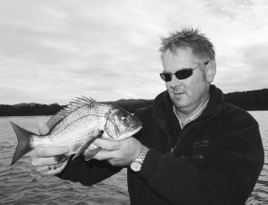 Treyton with a beaut winter black bream from Merimbula Lake, caught on a soft plastic and released after a few photos.